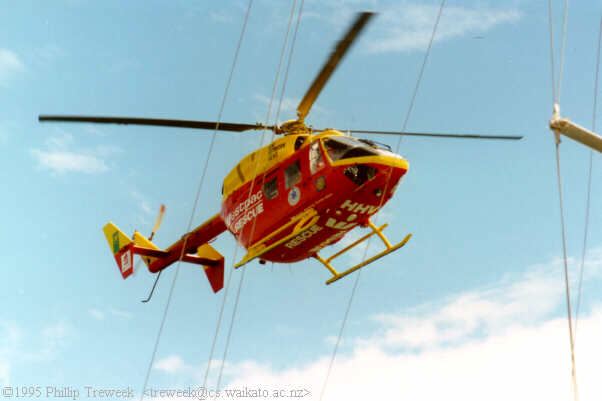 Rescue Helicopter hovers above the yacht carrying an injured youth